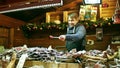 PARIS, FRANCE - DECEMBER, 31. Christmas and New Year market food stall vendor. Traditional sausages, meat