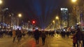 PARIS, FRANCE - DECEMBER, 31, 2016. Crowded Champs-Elysees street and famous triumphal arch Arc de Triomphe. New Year`s Royalty Free Stock Photo