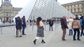 PARIS, FRANCE - DECEMBER, 31, 2016. Crowded square near the Louvre entrance, famous French museum and popular touristic