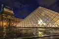 Night view of The Louvre Pyramid based in the main courtyard cour Napoleon of the Louvre Palace
