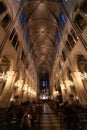 PARIS, FRANCE - DECEMBER 31, 2011:  Notre Dame de Paris cathedral, Interior, panorama of  stained-glass windows, pointed arches, Royalty Free Stock Photo