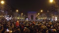 PARIS, FRANCE - DECEMBER, 31, 2016. Overhead shot of crowded Champs-Elysees street and light show on famous triumphal Royalty Free Stock Photo