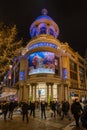 Paris, France - December 1, 2019: Parisiens walk out of printemps shopping mall