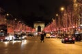 Street view at the Triumphal Arch and Champs Elysees avenue illuminated for Christmas Royalty Free Stock Photo
