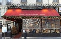 Typical Parisian restaurant Montparnasse decorated for Christmas in the heart of Paris. Christmas is one of the main