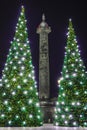 Paris, France - December 03, 2019 Vendome column between two christmas trees paris france by night in christmastime.