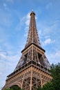 Paris, France, Eiffel Tower, iconic Paris landmark with setting sun and vibrant blue summer skies