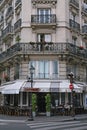 Paris, France : Elegant apartment building in the Marais district, with a cafe on the ground floor