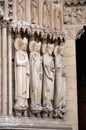 Paris, France - famous Notre Dame cathedral facade saint statues. UNESCO World Heritage Site.