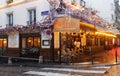 Cafe Le Vrai Paris at rainy morning . It is a traditional French cafe in the Montmartre district, Paris, France