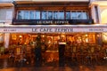 Cafe Zephyr at rainy evening . It is traditional Parisian restaurant located at Montmartre boulevard in 9th district of Royalty Free Stock Photo