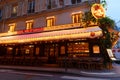 Empty outdoor terrace of Parisian cafe Le Chai Saint Germain in Paris city centre on a cloudy winter morning