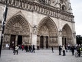 Paris, France February 22, 2013: Fragment of the front elevation with the entrance to the Notre Dame cathedral in Paris Royalty Free Stock Photo