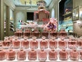 Group of elegant bottles of perfume in a Guerlain perfumery shop window