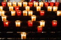 PARIS, FRANCE - FEBRUARY 1, 2017: Rows of firing lit votive candles inside Notre Dame de Paris, France. Royalty Free Stock Photo