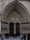 Paris, France February 22, 2013: Fragment of the front elevation with the entrance to the Notre Dame cathedral in Paris Royalty Free Stock Photo