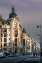 Typical Haussmann buildings and street near stock exchange market monument in paris Royalty Free Stock Photo