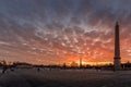 Wide angle view of Egyptian Luxor Obelisk Pillar with hieroglyphics in silhouette at the centre of Place de la Concorde in Paris Royalty Free Stock Photo