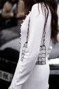 Paris, France - February, 29, 2024: woman wears Rabanne bag, fashion blogger outfit details.