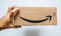 Holding Amazon e-Commerce carboard box