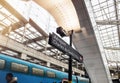 Male silhouette and Aeroport Charles de Gaulle 2 TGV SNCF singage in modern Royalty Free Stock Photo