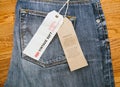 Levi`s jeans denim pants on wooden table Royalty Free Stock Photo