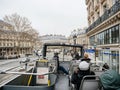 Parisian sightseeing tour bus with visitors tourists