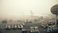 PARIS, FRANCE - JANUARY, 1, 2017. Airbus planes on aircraft parking at Charles de Gaulle airport. Foggy day, warm colors Royalty Free Stock Photo