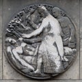 Incantation. Stone relief at the building of the Faculte de Medicine Paris.