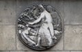 Incantation. Stone relief at the building of the Faculte de Medicine Paris.