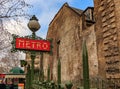 Ornate red art deco or art nouveau Parisian metro sign near by the Saint Germain des Pres church and Merto stop in Paris France Royalty Free Stock Photo