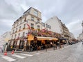 Typical Parisian cafe decorated with flowers in Paris, France Royalty Free Stock Photo