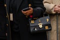 Paris, France - January, 22, 2024: woman wears Schiaparelli Bijoux bag, fashion blogger outfit details