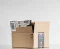 Open Amazon logotype printed on cardboard box side.