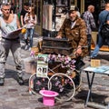 Organ grinder musician with decorated barrel organ hurdy gurdy