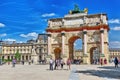 PARIS, FRANCE - JULY 06, 2016 : Arc de Triomphe du Carrousel (1806-1808) and people around, designed by Charles Percier near