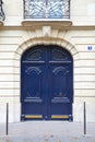 Blue wooden closed door in Paris, Givenchy building in France Royalty Free Stock Photo