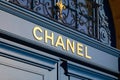 Chanel luxury store sign on blue door in place Vendome in Paris, France