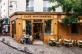 Senior couple sitting at table in Cafe Montmartre on Montmartre