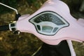 Close-up of Vespa pink color moped odometer
