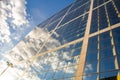 Closeup of The Grande Arche and a reflection of the cloudy sky in the La Defence business district of Paris Royalty Free Stock Photo