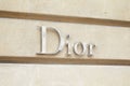 Dior, fashion luxury, silver sign in avenue Montaigne in Paris, France