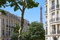 Eiffel Tower, Paris buildings and trees in a summer day, clear blue sky Royalty Free Stock Photo