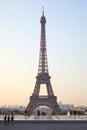 Eiffel tower with people and tourists seen from Trocadero, clear summer morning in Paris, France