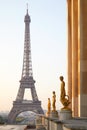 Eiffel tower and Trocadero golden statues, clear sunrise in Paris, France Royalty Free Stock Photo