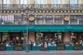 Famous Cafe de la Paix with people and tourists sitting outdoor in Paris, France