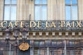 Famous Cafe de la Paix sign in golden letters in Paris, France
