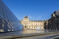 Fountain and fragment of the Pyramid of the Louvre