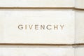 Givenchy, luxury fashion logo carved in stone in avenue George V in Paris, France