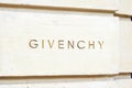 Givenchy, luxury fashion sign carved in stone in avenue George V in Paris, France